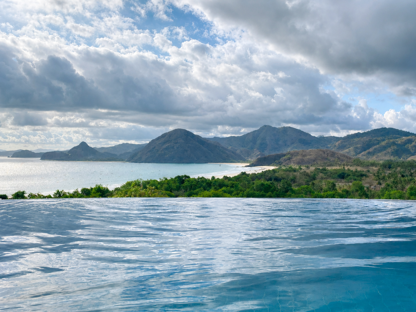 Panoramic view of Selong Belanak Bay from the pool at Villa Kenari, Lombok, Indonesia.