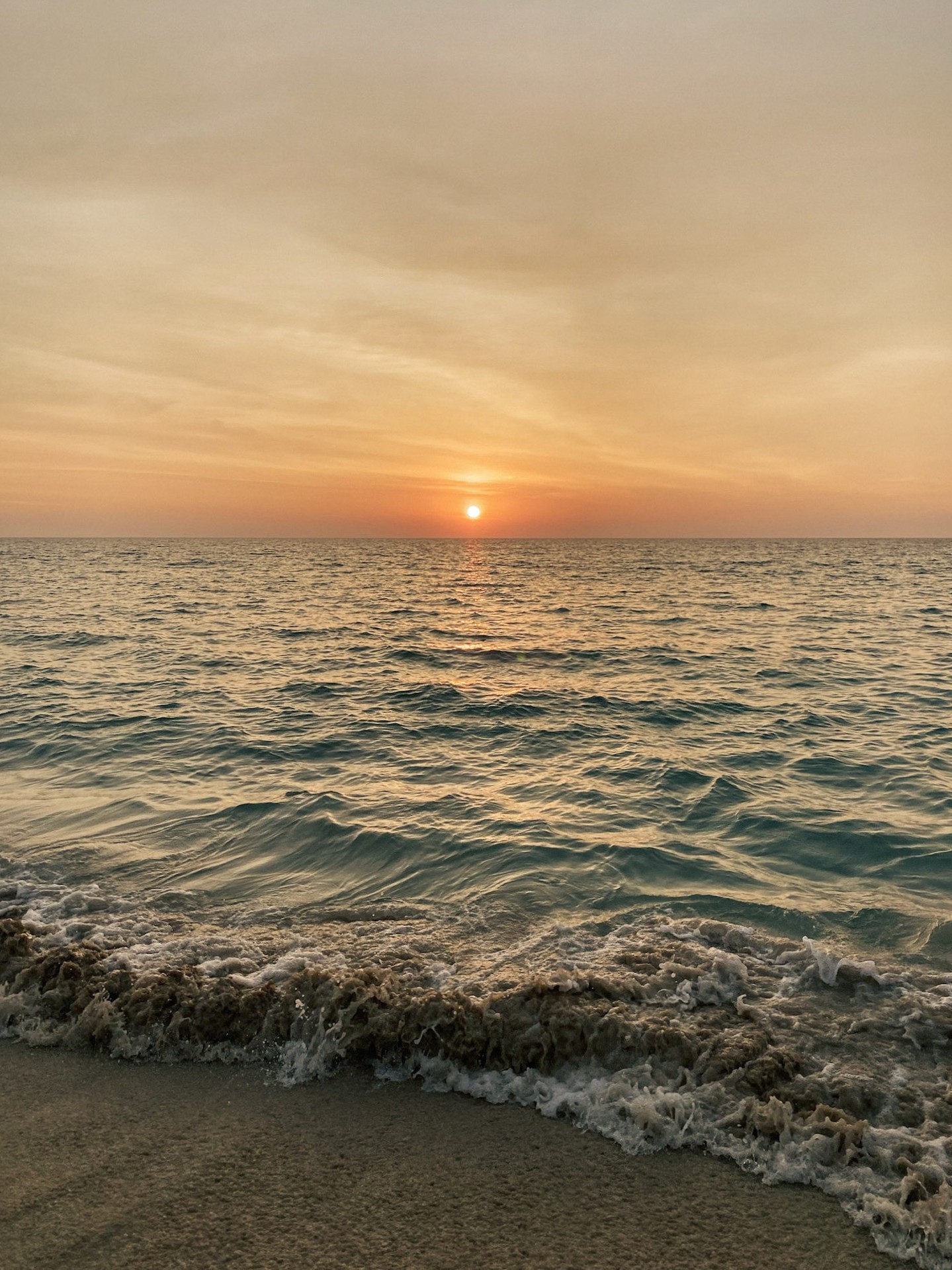 Sunset over the sea at Surin Beach, Phuket, Thailand.